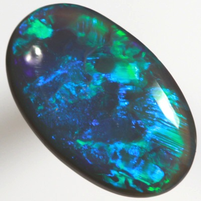 SOLID BLACK OPAL Bright electric peacock coloured roling flashes 